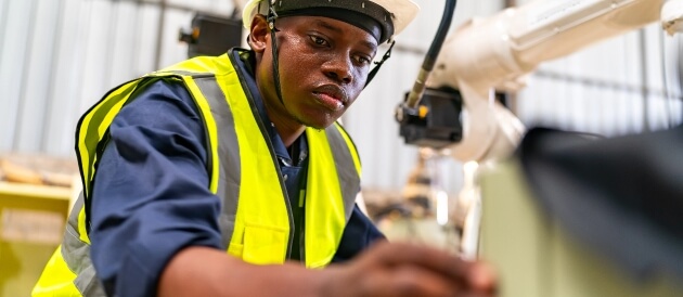Engineer inspecting manufacturing equipment for nitrogen system performance